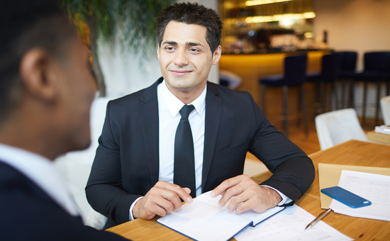 Content handsome lawyer meeting with client